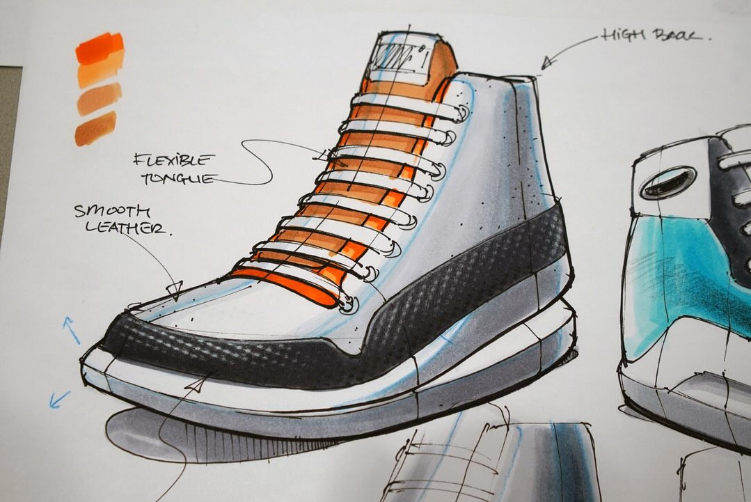 High-top sneaker with orange laces and dotted details by Martijn van de Wiel