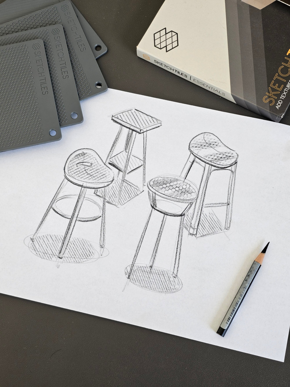 One Essentials Set beside four textured stool sketches